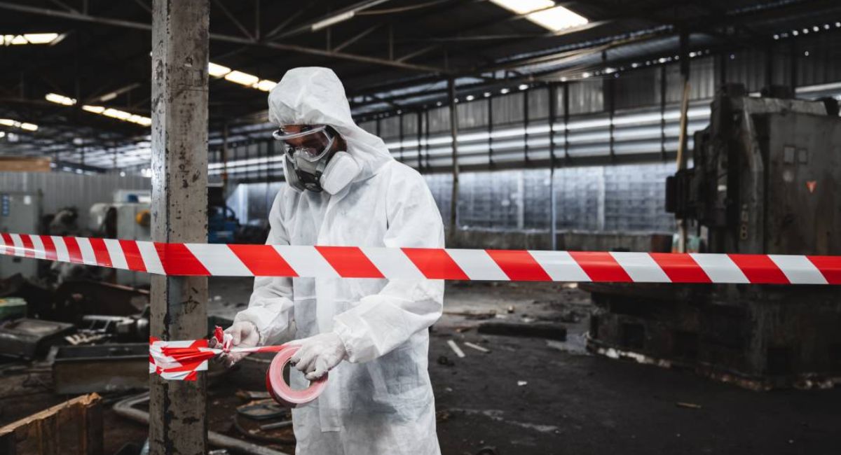 Asbestlint insulation material found in an old building, showing fibrous asbestos wrapping around heating pipes.